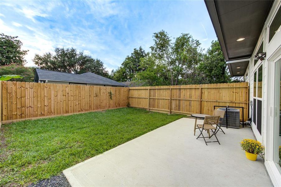 Large, private fenced in backyard with an oversized patio - perfect for grilling, entertaining, pets, and enjoying our pleasant Houston winters outside!