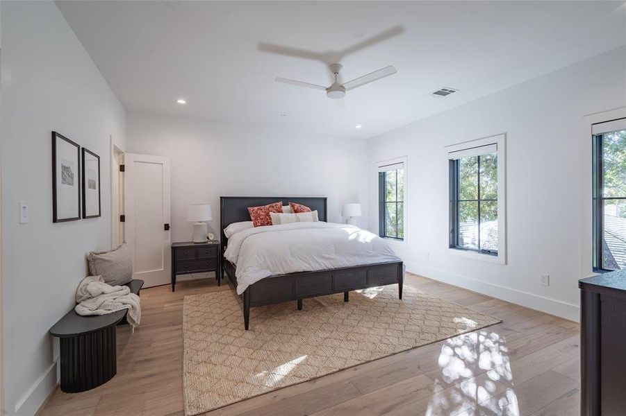 Bedroom with light wood-type flooring and ceiling fan