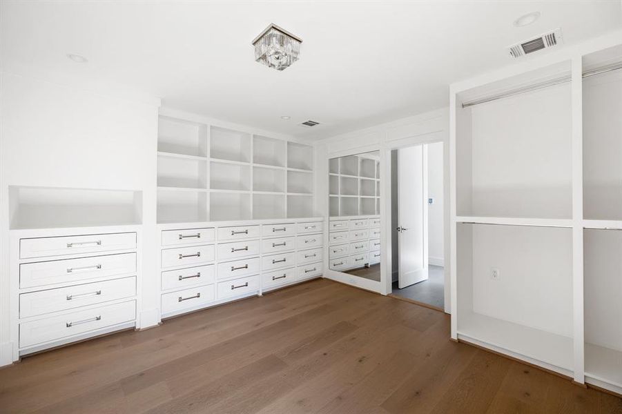 "Her" closet is a product of careful custom fabrication, showcasing a fusion of design and functionality. Doors, drawers, and dressers are thoughtfully integrated to cater to your specific storage needs, ensuring a clutter-free environment.