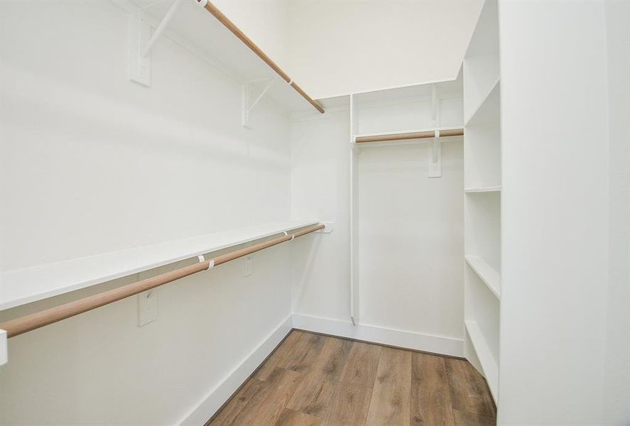 Primary Her Walk-In Closet