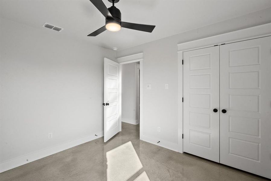 Unfurnished bedroom with a closet and ceiling fan