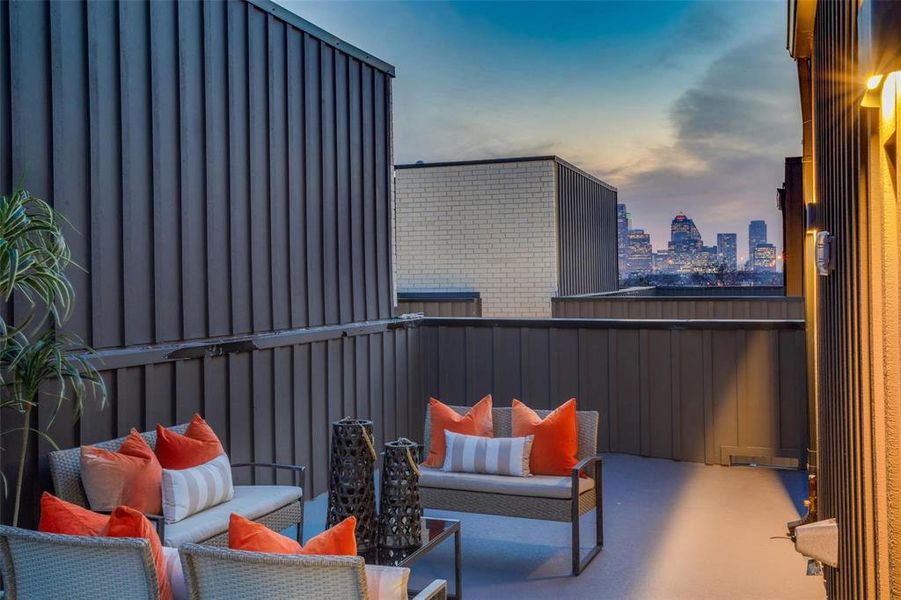 Balcony at dusk with outdoor lounge area