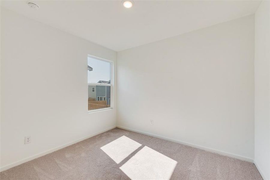 Unfurnished room with light colored carpet