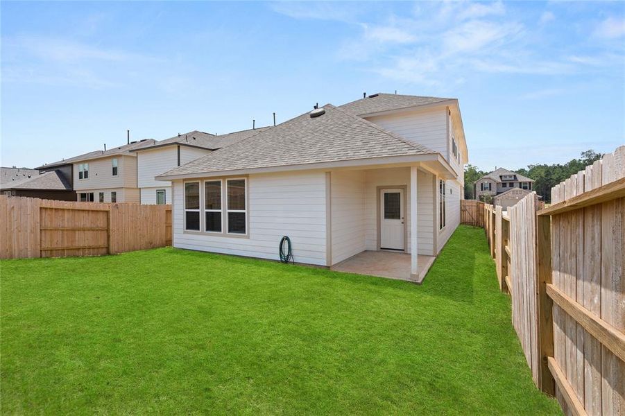 This backyard is perfect for family gatherings, social events, or simply unwinding in the fresh air.