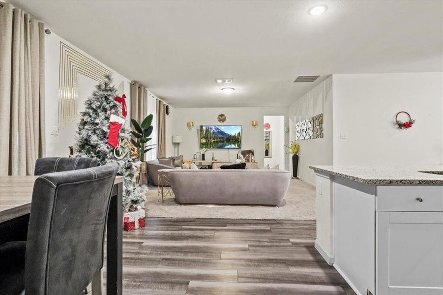 Living room with dark hardwood / wood-style flooring