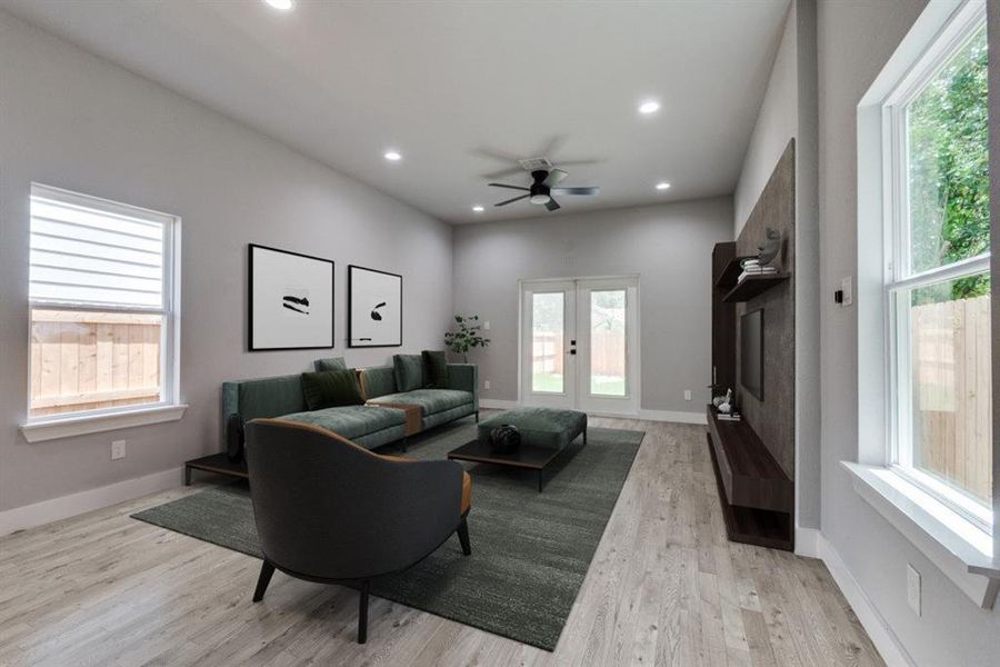 Living room with light hardwood / wood-style flooring, a healthy amount of sunlight, ceiling fan, and french doors