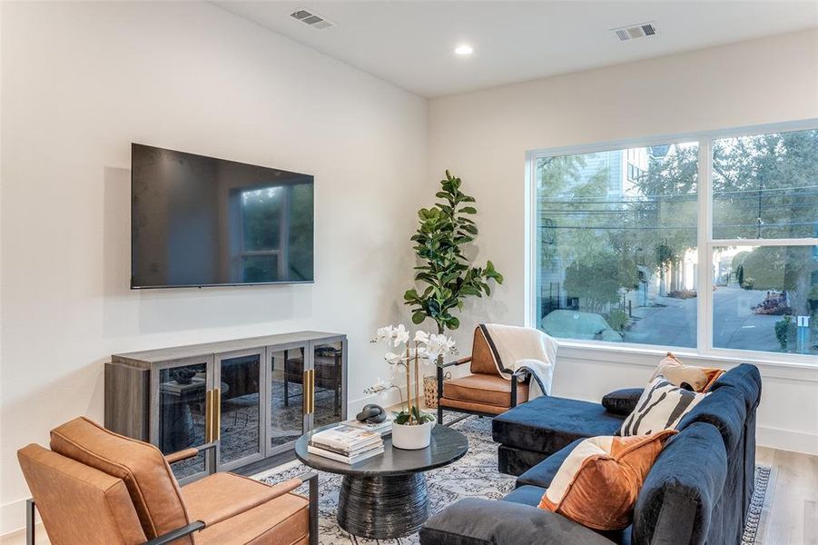 Living room with wood-type flooring