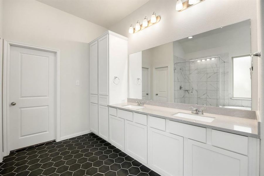 This primary bathroom is definitely move-in ready! Featuring a spa like walk-in shower with tile surround, separate garden tub for soaking after a long day with custom tile detailing, bright cabinets with light countertops, spacious walk-in closet with shelving, high ceilings, neutral paint, sleek and modern finishes.