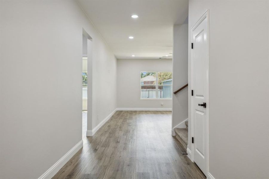 Hallway featuring wood-type flooring