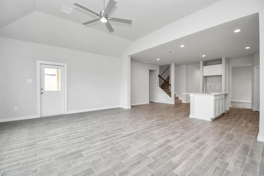 Take another glimpse into the heart of the home with this additional view of the family room—a sprawling space ready to accommodate all your gatherings. Sample photo, actual color and selections can vary.