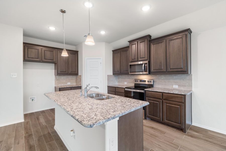 Kitchen | Concept 1660 at Hunters Ridge in Crowley, TX by Landsea Homes