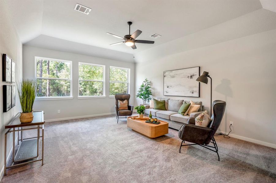 Spacious and inviting game room upstairs. Perfect for family gatherings and casual lounging.