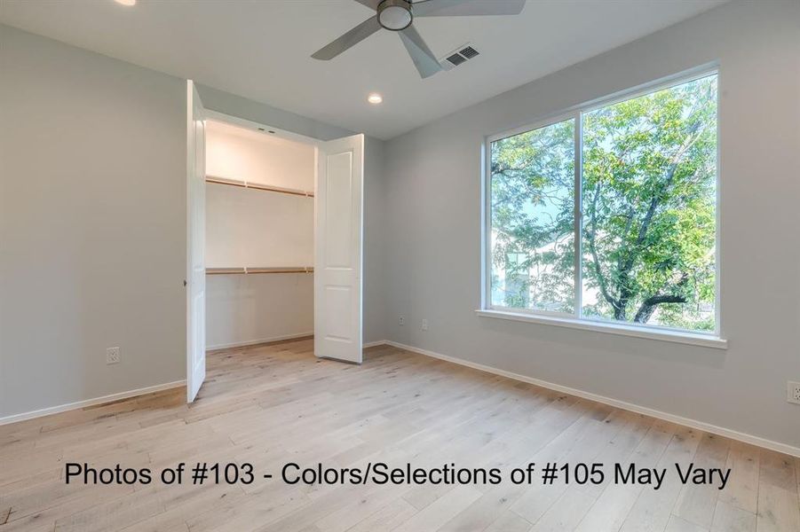 Primary Bedroom with view of one of the two walk-in closets.