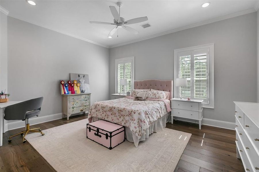 The third spacious bedroom up. Private bathroom is included with this bedroom. Beautiful wood floors, crown molding and shutters complete this room.