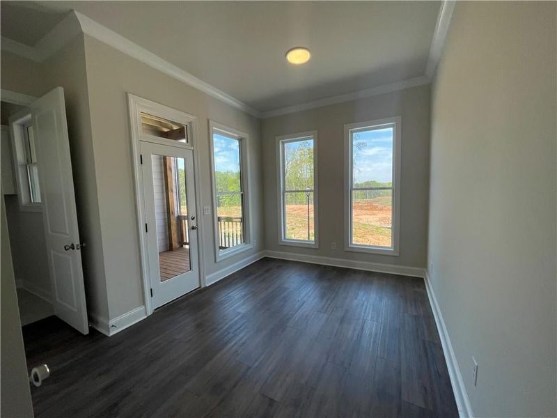 Around the corner from the kitchen has a Sunroom with natural light for your office! Also by this space is the laundry room, a powder bath and a private deck!!