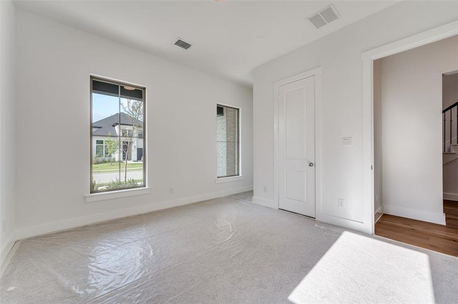 Unfurnished bedroom with light wood-type flooring