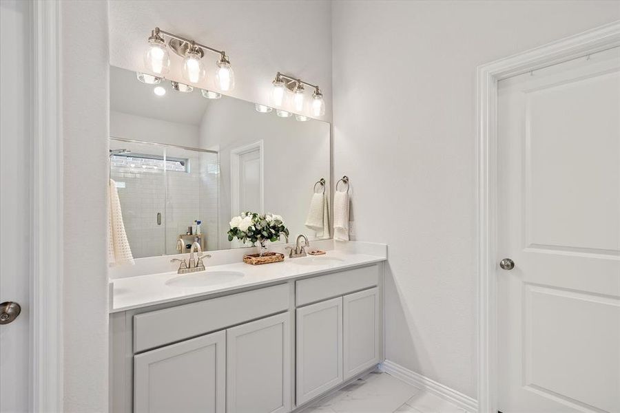 Bathroom with walk in shower and double vanity