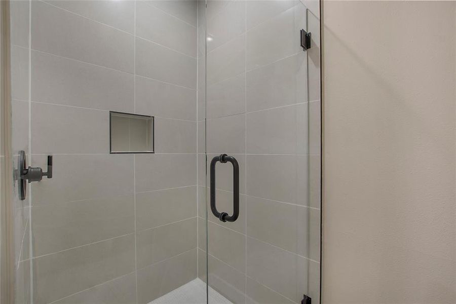 Bathroom with a shower with door