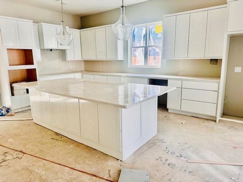 Actual Kitchen with white cabinets and quartz counters! And cabinets on back of island!