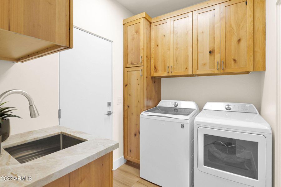 Generous Cabinetry and Laundry Sink