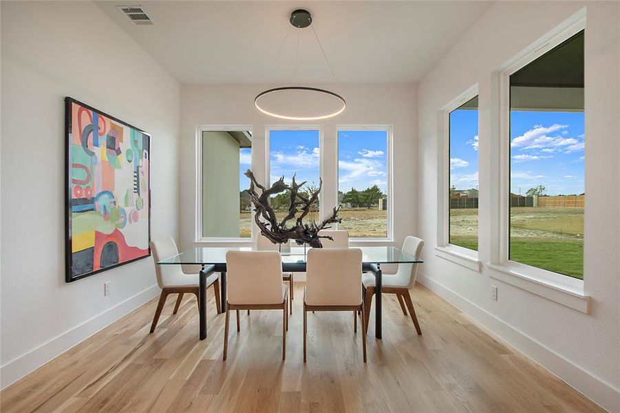 Dining room with light wood-type flooring