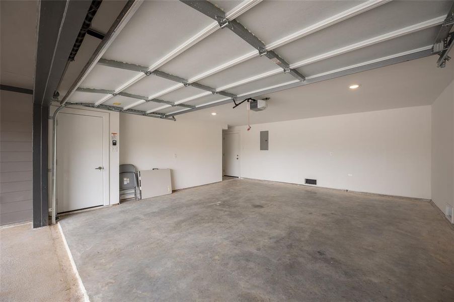 *Representative Photo. This is a spacious, clean two-car garage with a high ceiling, concrete floor.