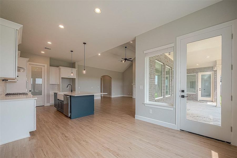 Dining Area into Kitchen and Covered Back Porch