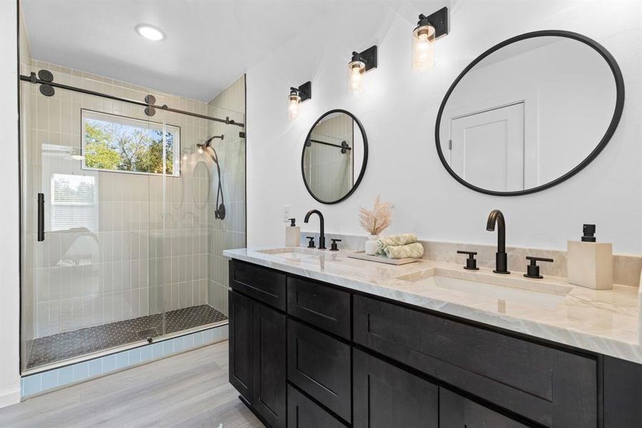 Bathroom with vanity, hardwood / wood-style floors, and walk in shower