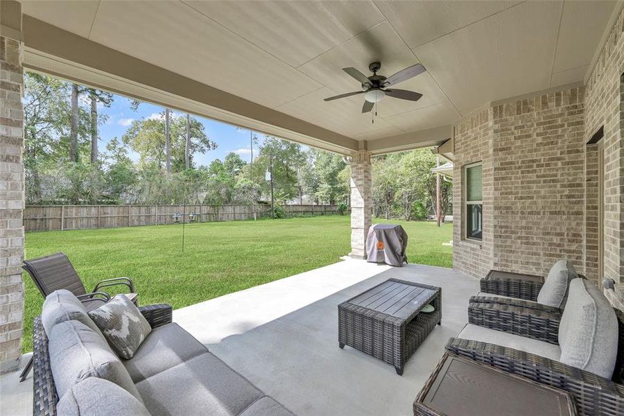 Enjoy every day under the large covered patio over looking the huge backyard