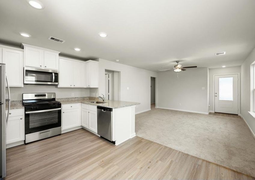 The kitchen is open to the spacious family room.