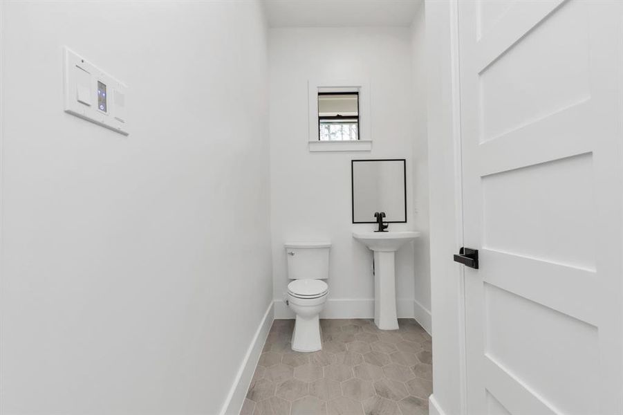 Chic Powder Room with Modern Fixtures