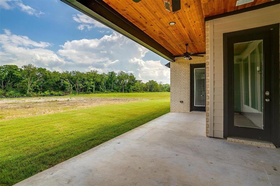 View of patio featuring ceiling fan