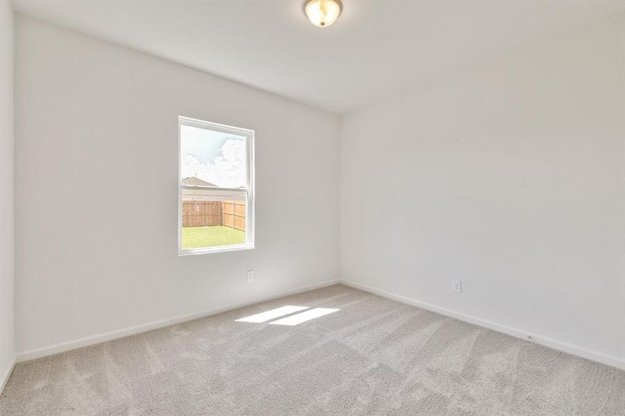 Spare room with light carpet