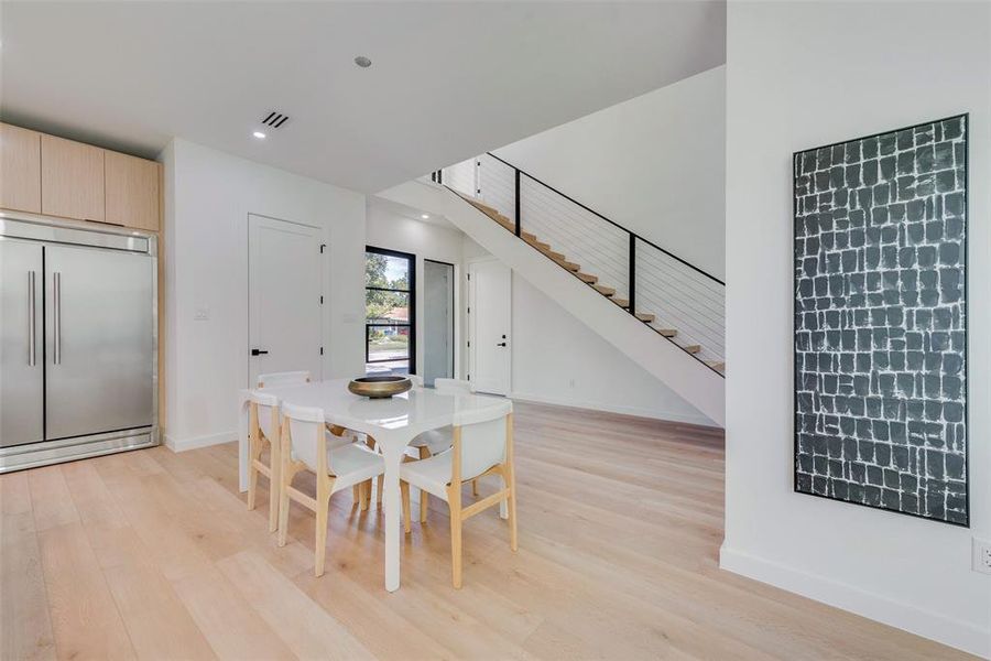 Dining space with light wood-type flooring