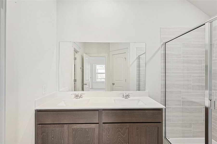 Bathroom with vanity and an enclosed shower