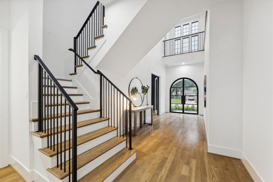 View back toward the gorgeous, custom double door entry and dramatic foyer.  Exceptional details throughout this home.