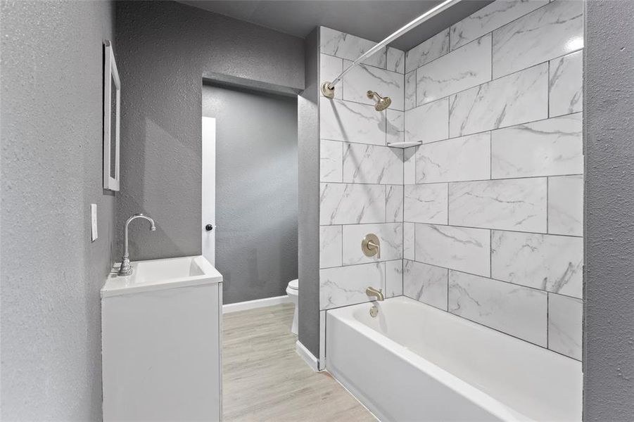 This bathroom is so nice!  Full bathroom with tub/shower combo, sink and mirror.