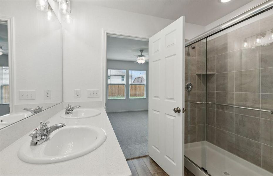 Large owner's suite with large shower*real home pictured