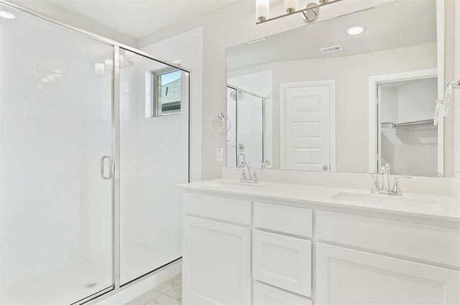 Primary bathroom in the Nobel home plan by Trophy Signature Homes – REPRESENTATIVE PHOTO