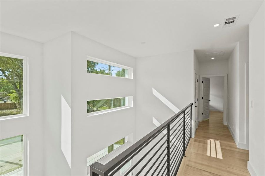 Hall featuring light wood-type flooring