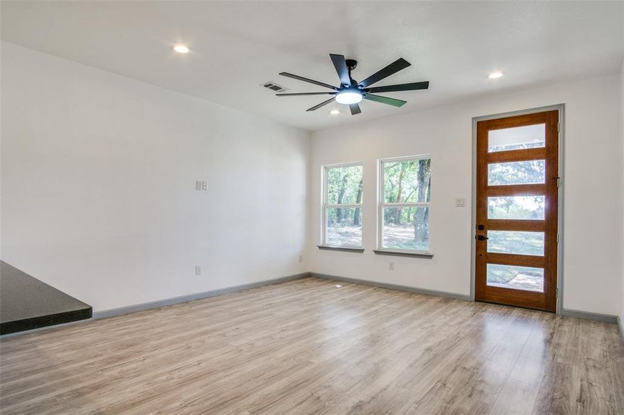 Foyer featuring ceiling fan and light hardwood / wood-style flooring