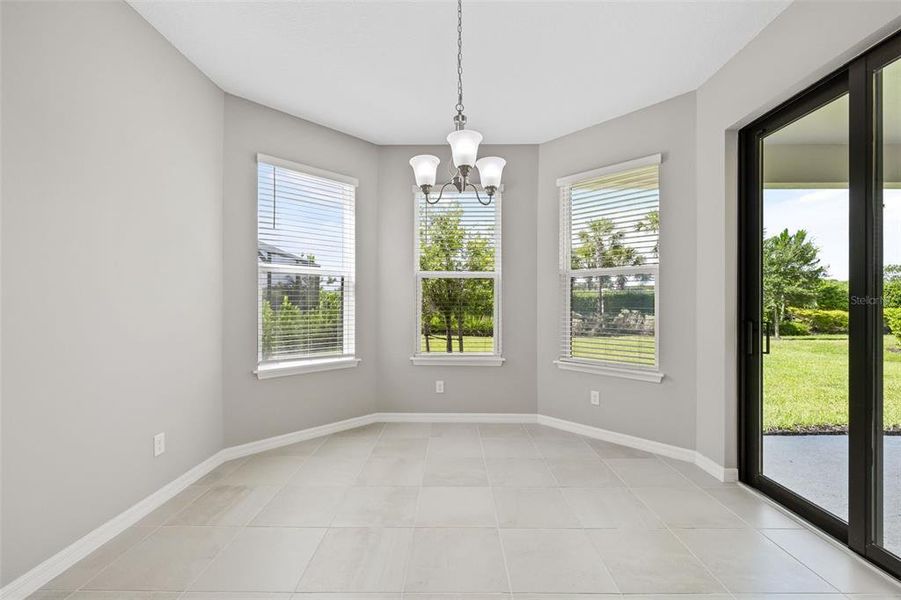 Breakfast Nook off the kitchen with sliders that lead out to the back porch.