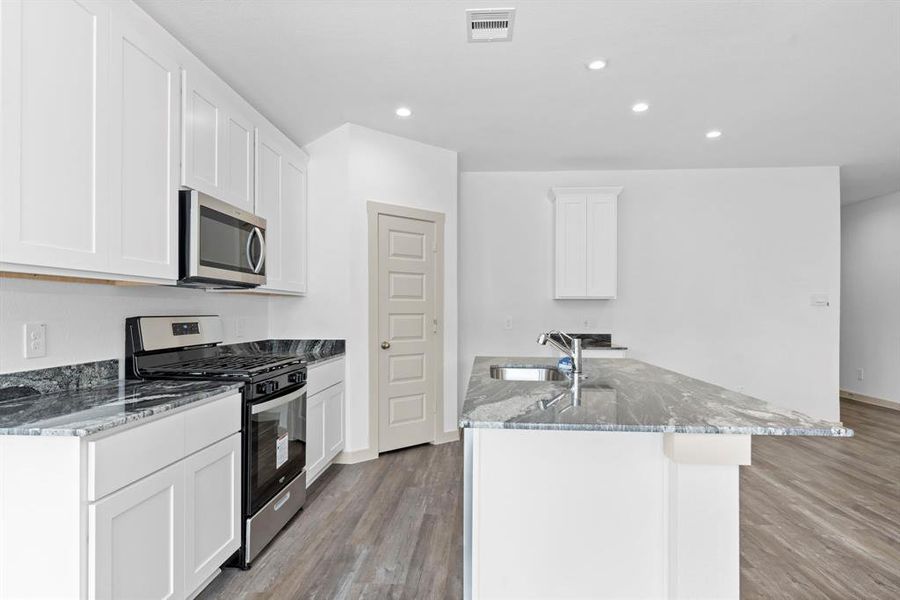 Wonderful Stainless Steel Whirlpool appliances include microwave, dishwasher & gas range! Huge walk-in pantry for all your storage needs! **Image Representative of Plan Only and May Vary as Built**