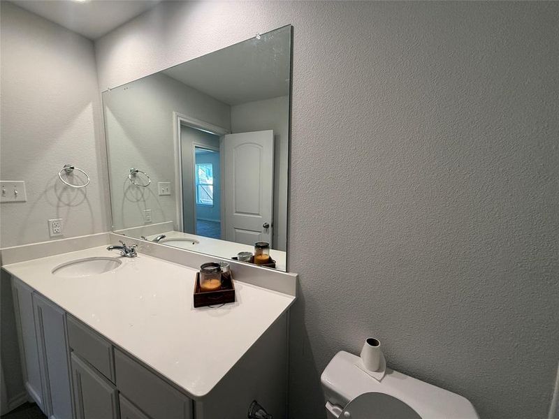 Bathroom with vanity and toilet