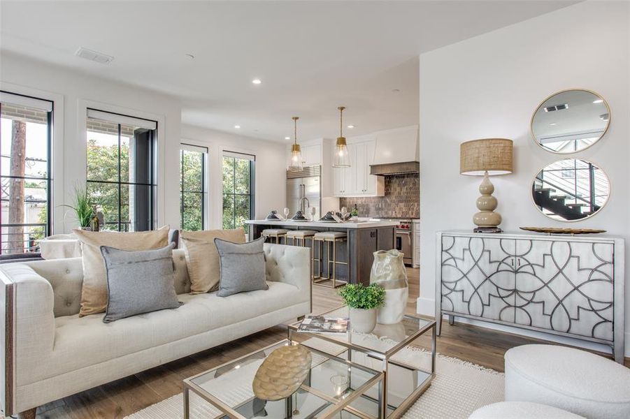 Living room with light hardwood / wood-style flooring