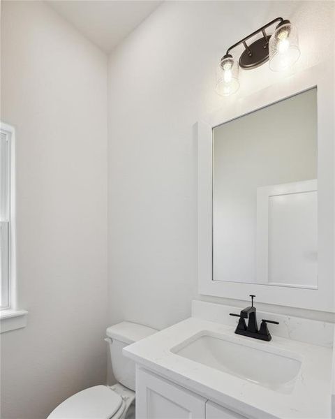 Bathroom featuring toilet and vanity