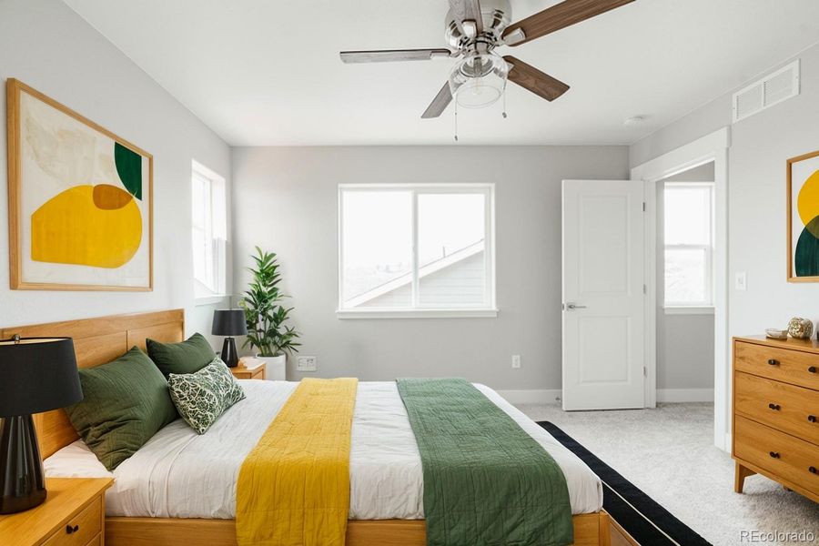 corner windows, an attached walk in closet and beautifully appointed primary bath