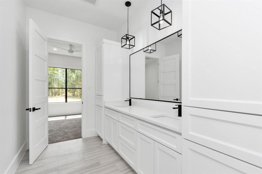 Modern dual-access bathroom (Jack and Jill style) with elegant finishes and ample natural light.