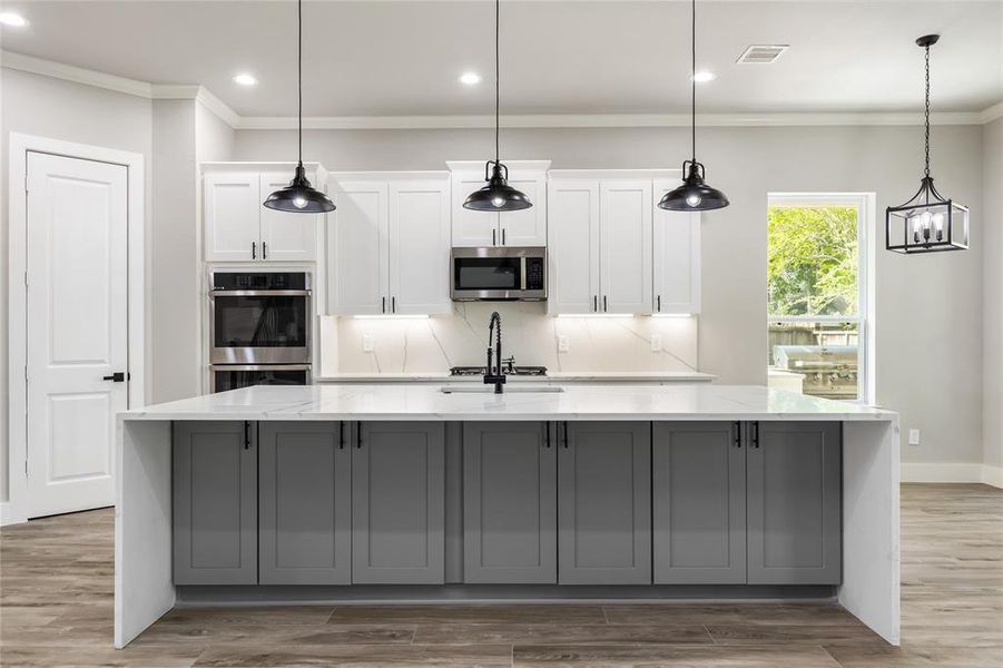 Black fixtures stand out against the bright kitchen