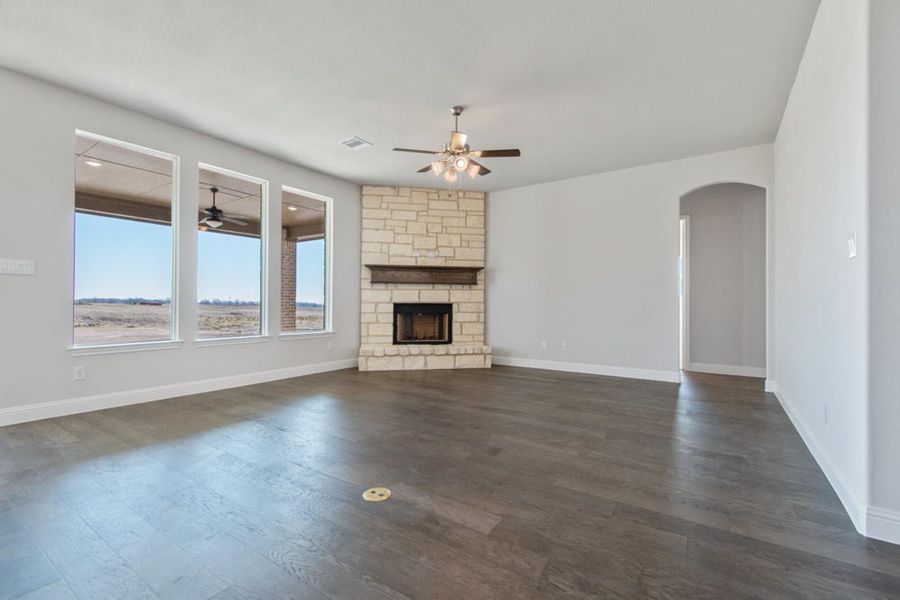 Family Room | Concept 2406 at Hidden Creek Estates in Van Alstyne, TX by Landsea Homes